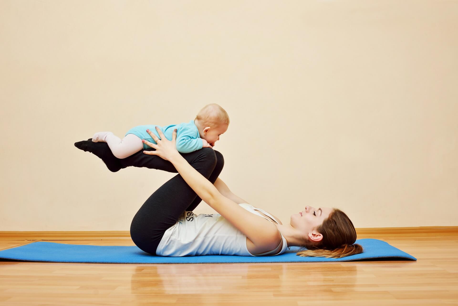 Mother exercising with baby